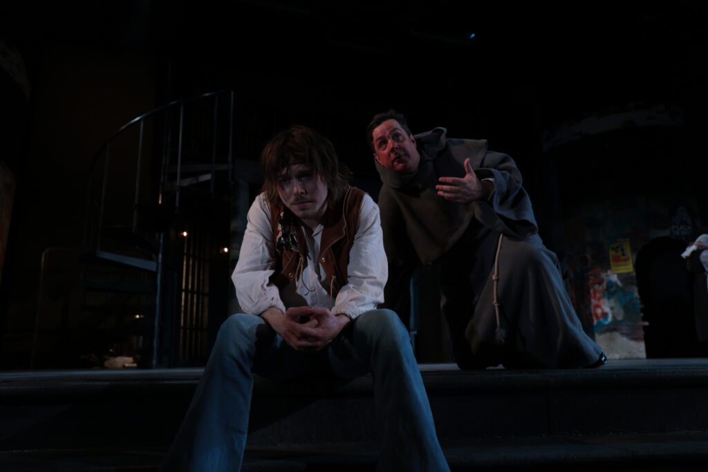 The Duke (Chris Thorn) counsels Claudio (Luke McGreevey) in just about the most unhelpful way.