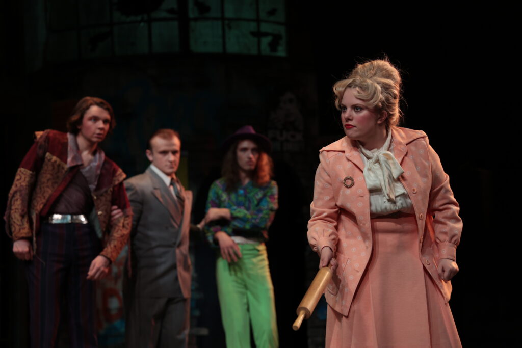 
(Jacob McGaughey as Pompey Bum, Connor Heim as an officer, Zach Haas as Master Froth, and McKinley Kirk as Elbow.) 